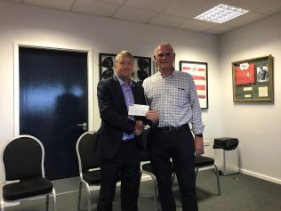 Nick Broady receives a cheque on behalf of Pied-Piper