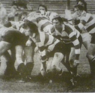 Peter Kingston with the ball playing against Harlequins at Kingsholm 1974. Flankers Eddie Pinkney and Dick Smith look to join the attack